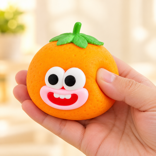 Orange Crunchy Squishy Toy with a Green Leaf Top and Funny Face · mproduct-14d72f1fbfacb1edf3ae