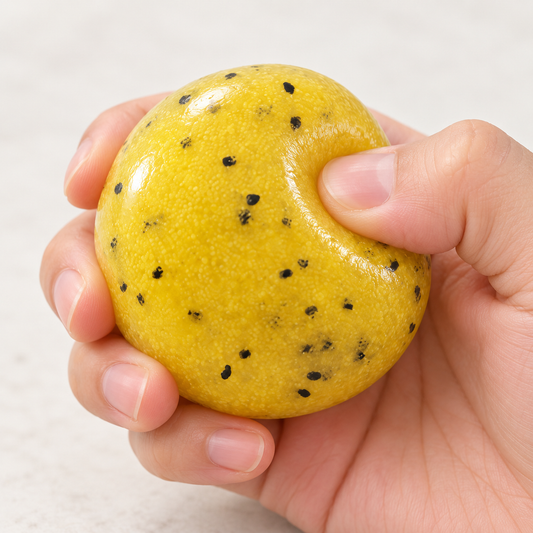Yellow Squishy Ball with Black Speckles for Squeeze Play · mproduct-5676ca003dad952aa497