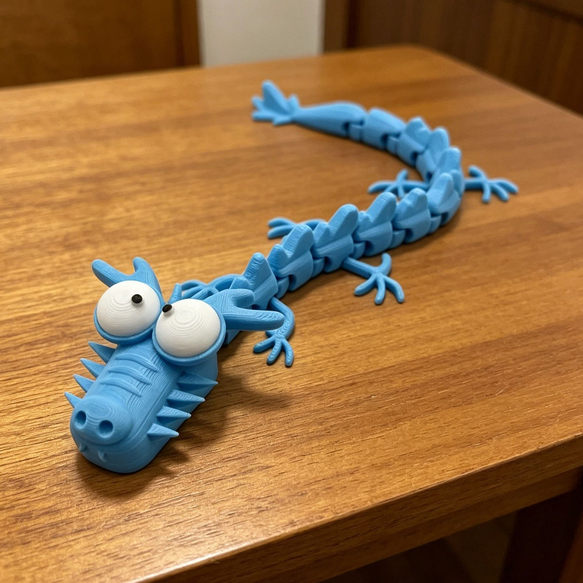 Big-Eyed Articulated Dragon Figurine – 4 Colour Options · mproduct-99b00a2359a21147438d